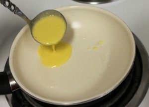Breafast Crepes ladle batter into hot greased pan
